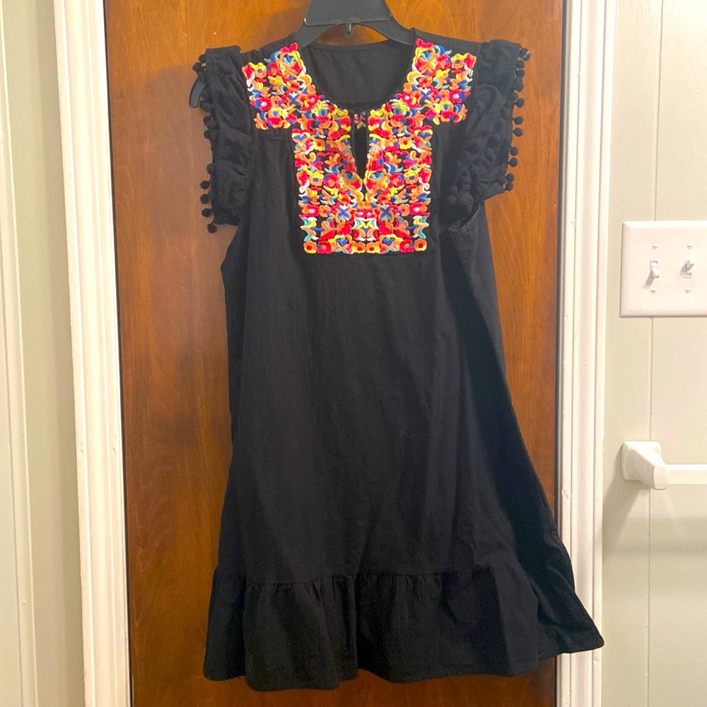 Black linen dress with multicolor floral design and pompom sleeve detail